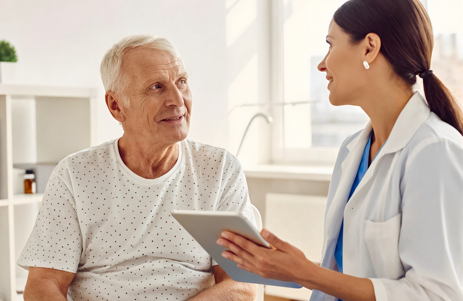 A senior patient talking with a provider about care options at Total Health Urgent Care in Covington, Louisiana