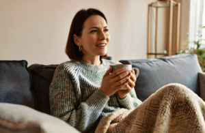 Covington woman resting at home with tea while recovering from bronchitis and a lingering cough