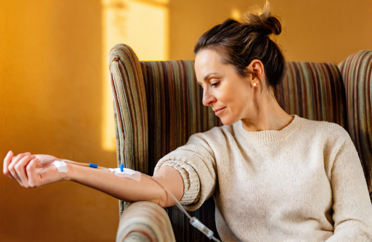 Woman receiving an IV therapy infusion in Covington, LA, where drip prices run $100 to $200